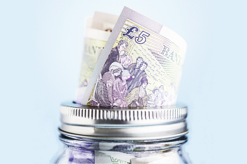 British currency in donation or savings jar