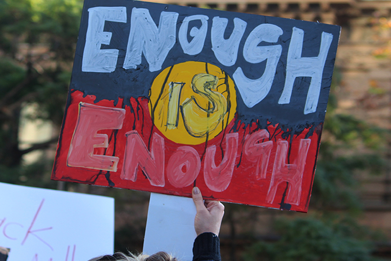 Picture of Aboriginal policing protest placard saying 'enough is enough'