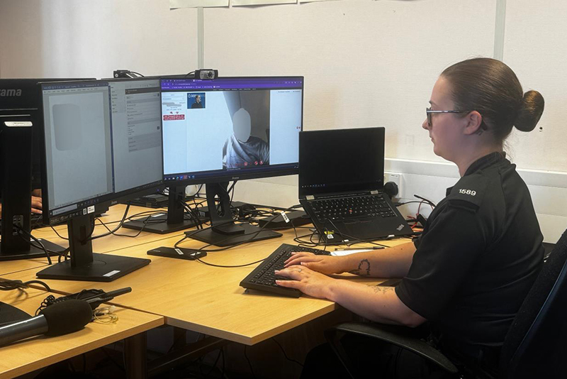 Dorset enhanced video response officer looking at computer screen