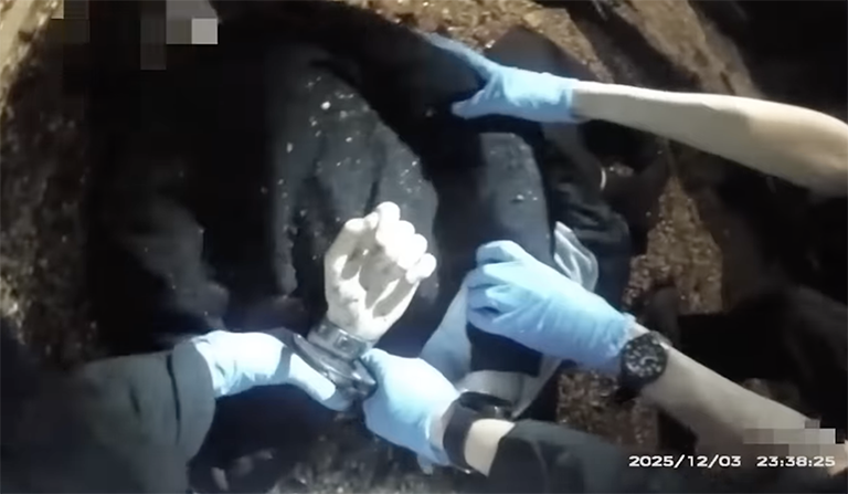 Screenshot from the body can footage of the arrest of Henry Now
