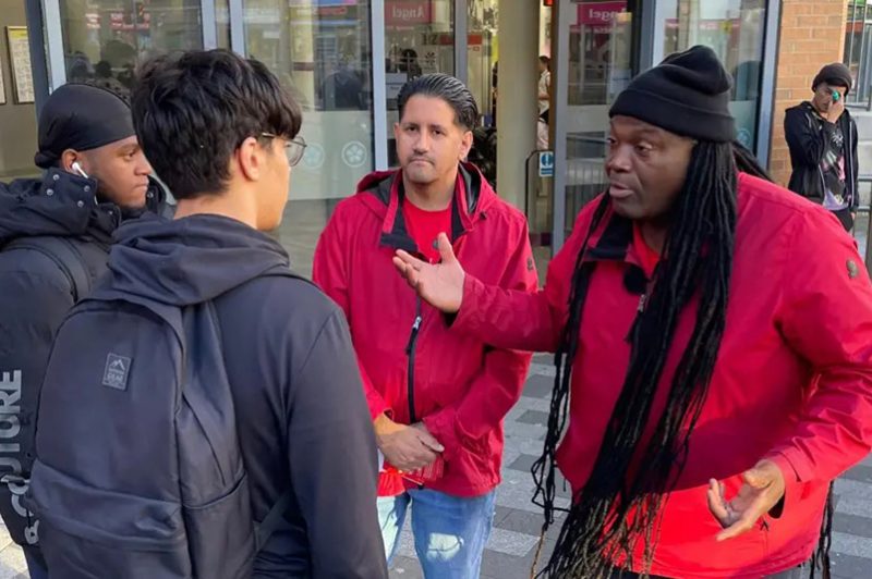 Two Leicester street outreach staff talk to two local youngsters