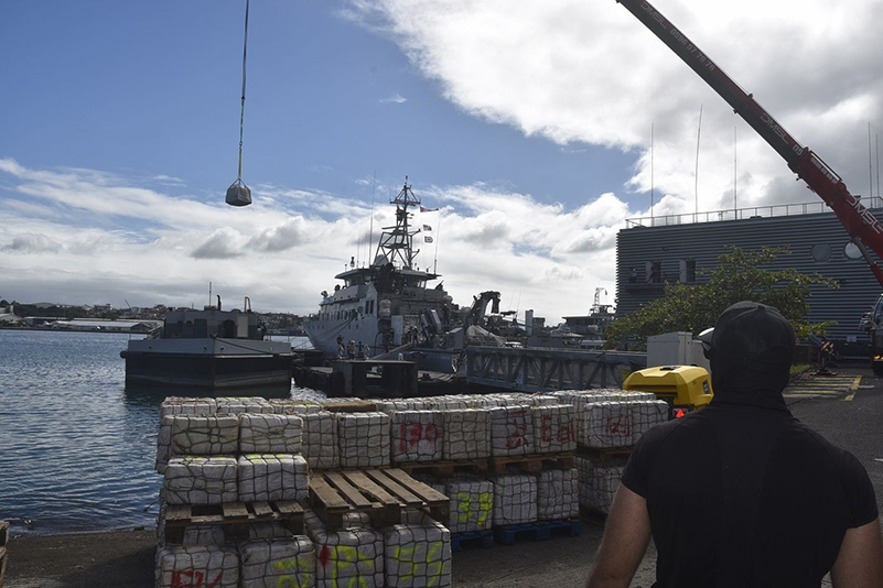 Seized bales of cocaine being offloaded from a ship