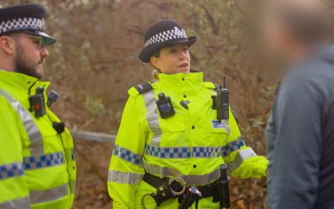 Merseyside Police officers stop a person suspected of carrying a knife