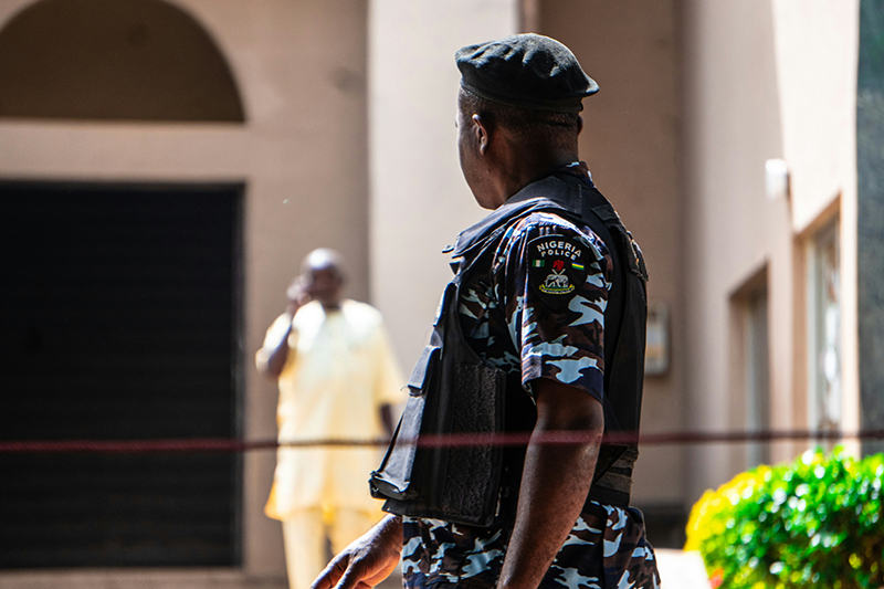Nigerian Police Force officer looking away from the camera