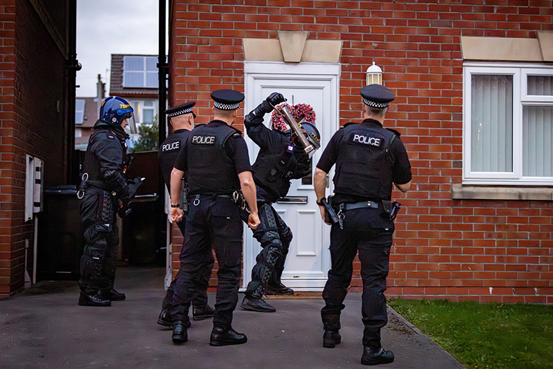 Merseyside Police carry out a drugs raid