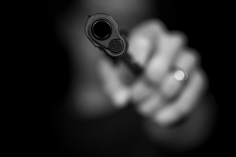 Gun point out of the darkness