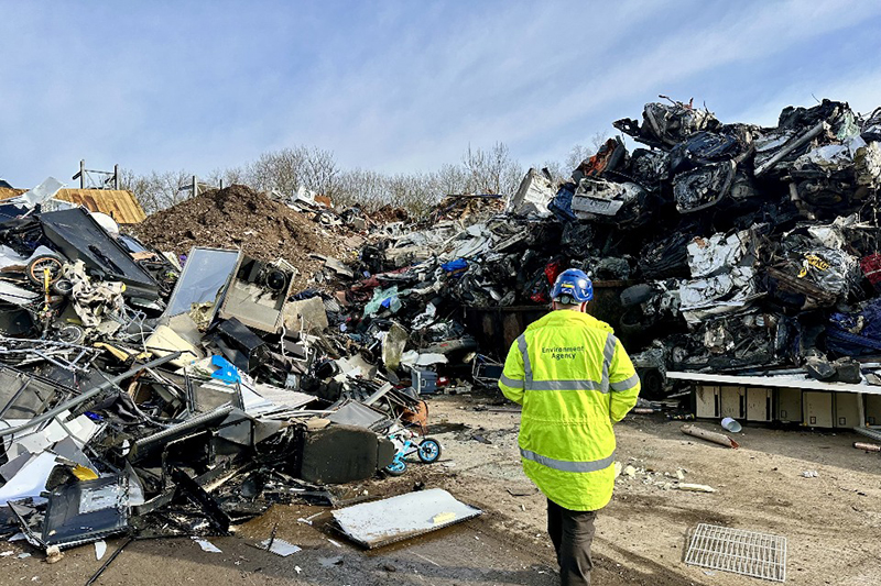 Environment Agency officer inspecting metal waste – waste crime