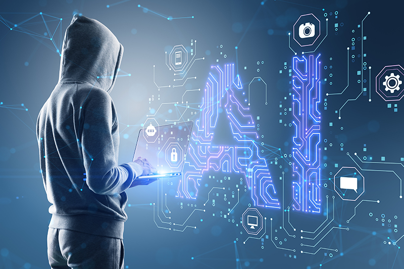 Side view of hacker in hoodie using laptop with glowing blue AI hologram on blurry background.