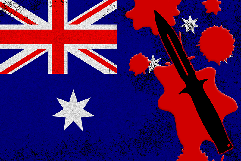 Australia flag and black tactical knife in red blood. Concept for terror attack or knife crimes with lethal outcome