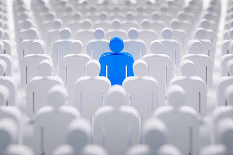 Blue individual in the crowd - concept of leadership and excellence
