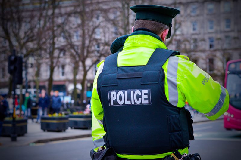 Rear view of a PSNI officer on patrol in Belfast City Centre