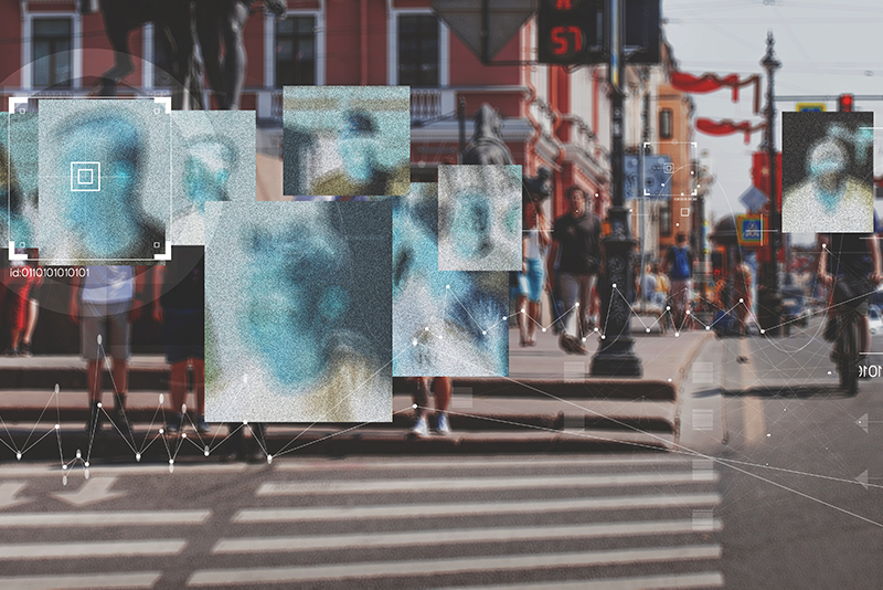 CCTV still of a street with people on it, all faces blurred, highlighting privacy issues