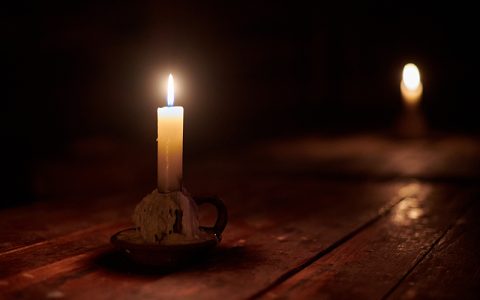 Burning candles, symbolic of witchcraft or ritualistic abuse