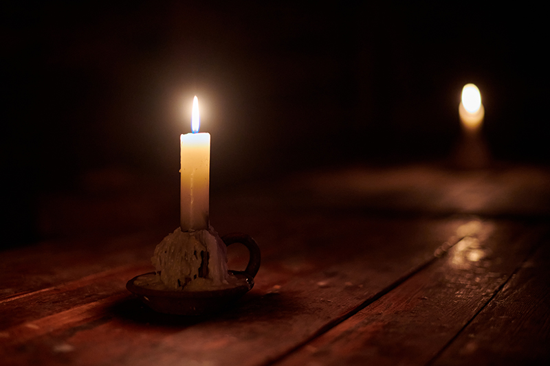 Burning candles, symbolic of witchcraft or ritualistic abuse