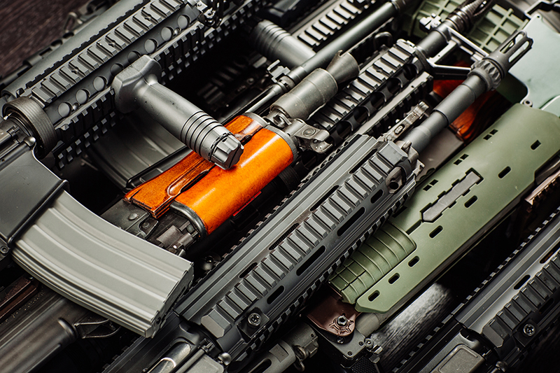 Close up details of many confiscated modern firearms supplied, smuggled, and detained