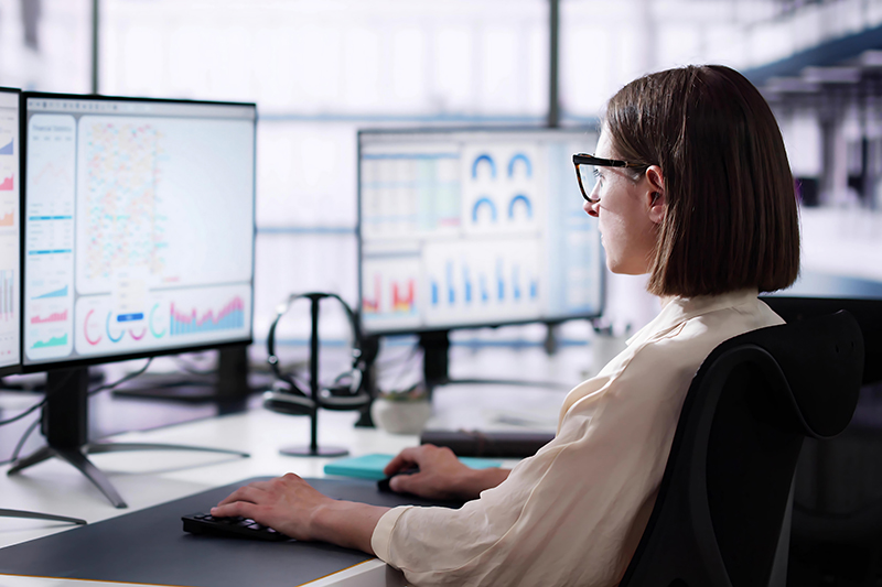 Female Data Analyst Using Data Analytics