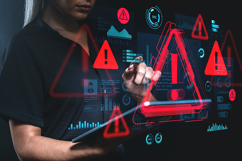 Woman interacts with digital warning interface, futuristic style, on dark background. Concept of cybersecurity alert, hacking, or system failure warning