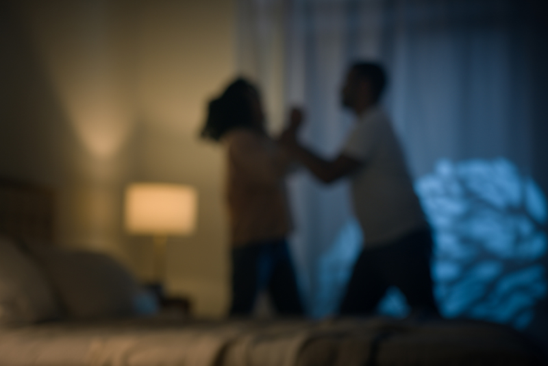 Blurred image of angry man fighting a woman domestic violence