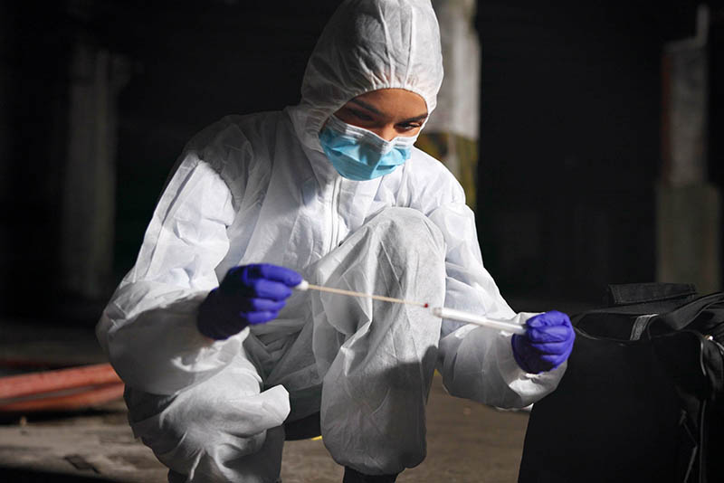 Woman, swab and expert investigation at crime scene, blood sample and discovery of dna marker, forensics concept