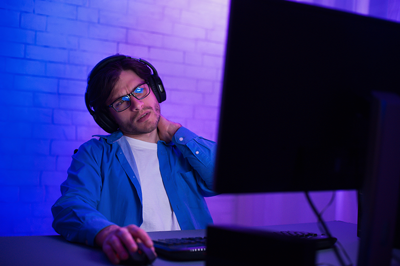 man exhausted by viewing computer screen