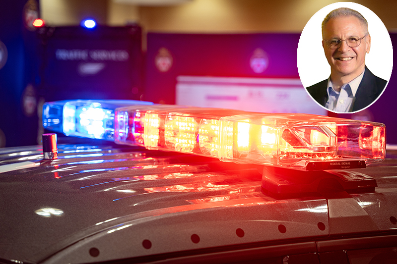 Blue and red police sirens on top of a patrol car with CCPE President Michael Federico inset