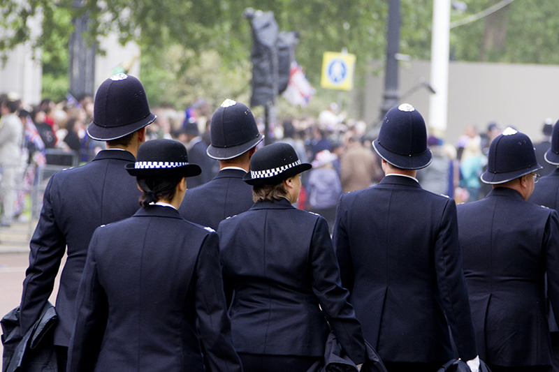 Police officers in uniform, rear view