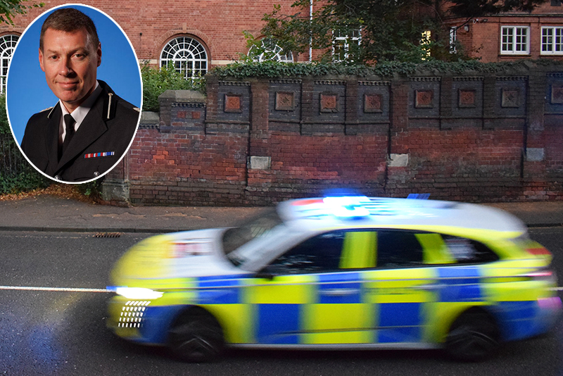 Motion-blurred British police car with flashing lights racing past historic red brick buildings, with ACC Matt Boyle inset