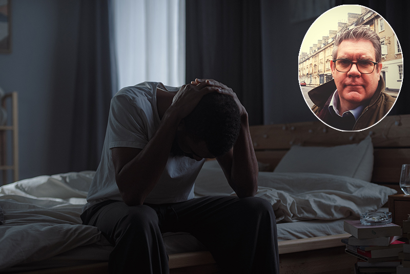 African American man holds head in hands suggesting state of emotional distress, with inset picture of Dr Mark Brain