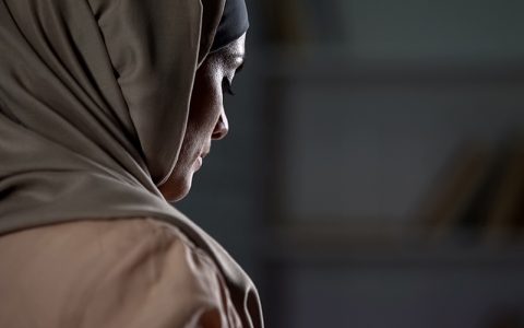 woman with hijab possible domestic abuse victim