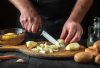 Chef chopping potatoes