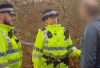 Merseyside Police officers stop a person suspected of carrying a knife
